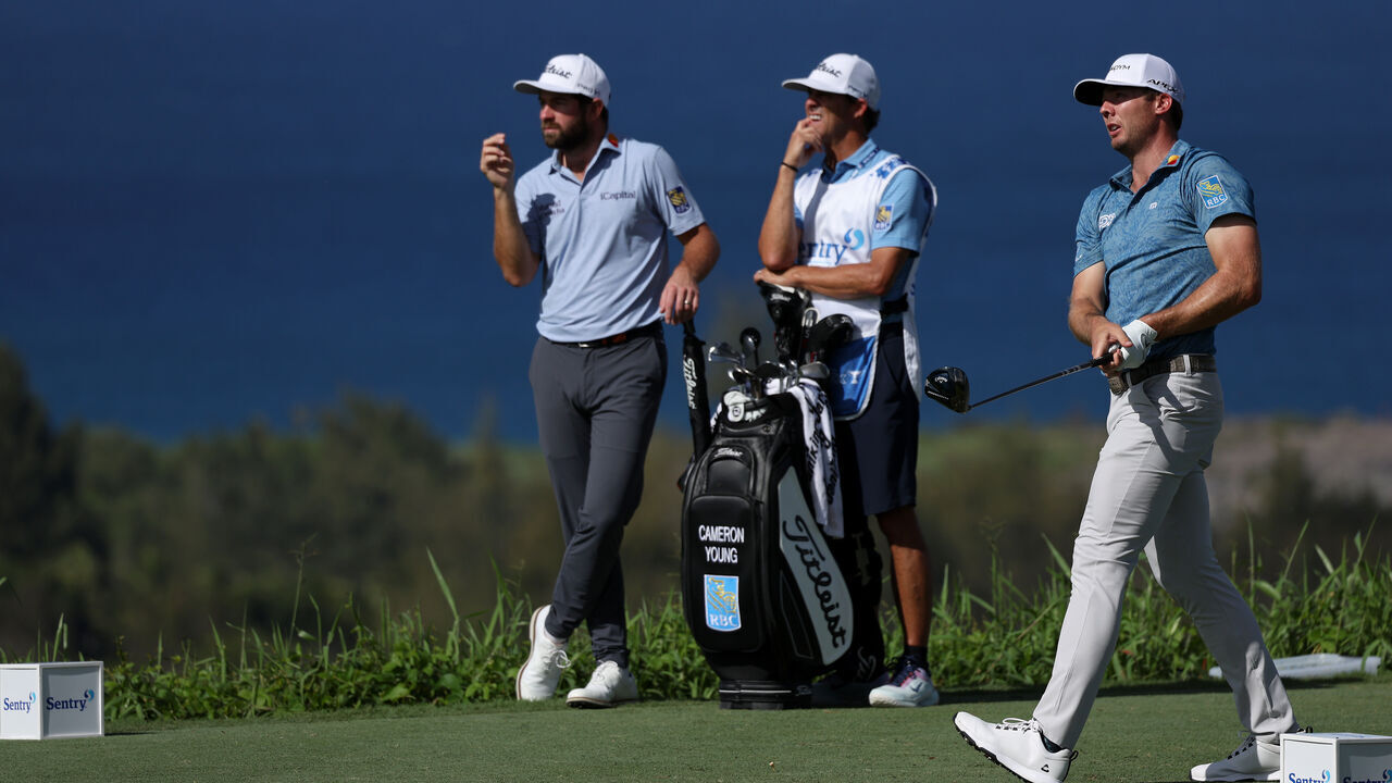 LAHAINA, HAWAII - JANUARY 06: Sam Burns of the United States watches his tee shot on the fifth hole as Cameron Young of the United States looks on during the second round of the Sentry Tournament of Champions at Plantation Course at Kapalua Golf Club on January 06, 2023 in Lahaina, Hawaii.