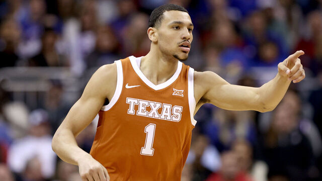 KANSAS CITY, MISSOURI - MARCH 11: Dylan Disu #1 of the Texas Longhorns celebrates a dunk against the Kansas Jayhawks during the first half in the Big 12 Tournament Championship game at T-Mobile Center on March 11, 2023 in Kansas City, Missouri.