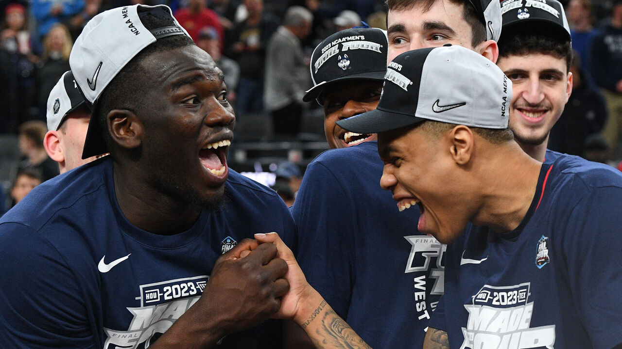 LAS VEGAS, NV - MARCH 25: UConn Huskies forward Adama Sanogo (21) and UConn Huskies guard Jordan Hawkins (24) celebrate after advancing to the Final Four after winning the NCAA Division I Men's Championship Elite Eight round basketball game between the Gonzaga Bulldogs and the UConn Huskies on March 25, 2023 at T-Mobile Arena in Las Vegas, NV.