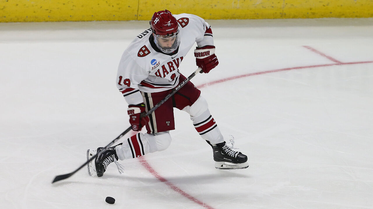 BRIDGEPORT, CT - MARCH 24: Harvard Crimson forward Matthew Coronato (19) takes a shot on goal during the NCAA Division 1 Men's Regional Hockey Championship game between Ohio State Buckeyes and Harvard Crimson on March 24, 2023, at Total Mortgage Arena in Bridgeport, CT.