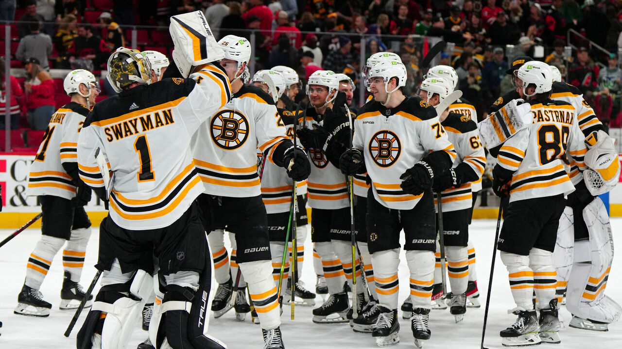 RALEIGH, NORTH CAROLINA - MARCH 26: The Boston Bruins celebrate after defeating the Carolina Hurricanes in a shootout at PNC Arena on March 26, 2023 in Raleigh, North Carolina.