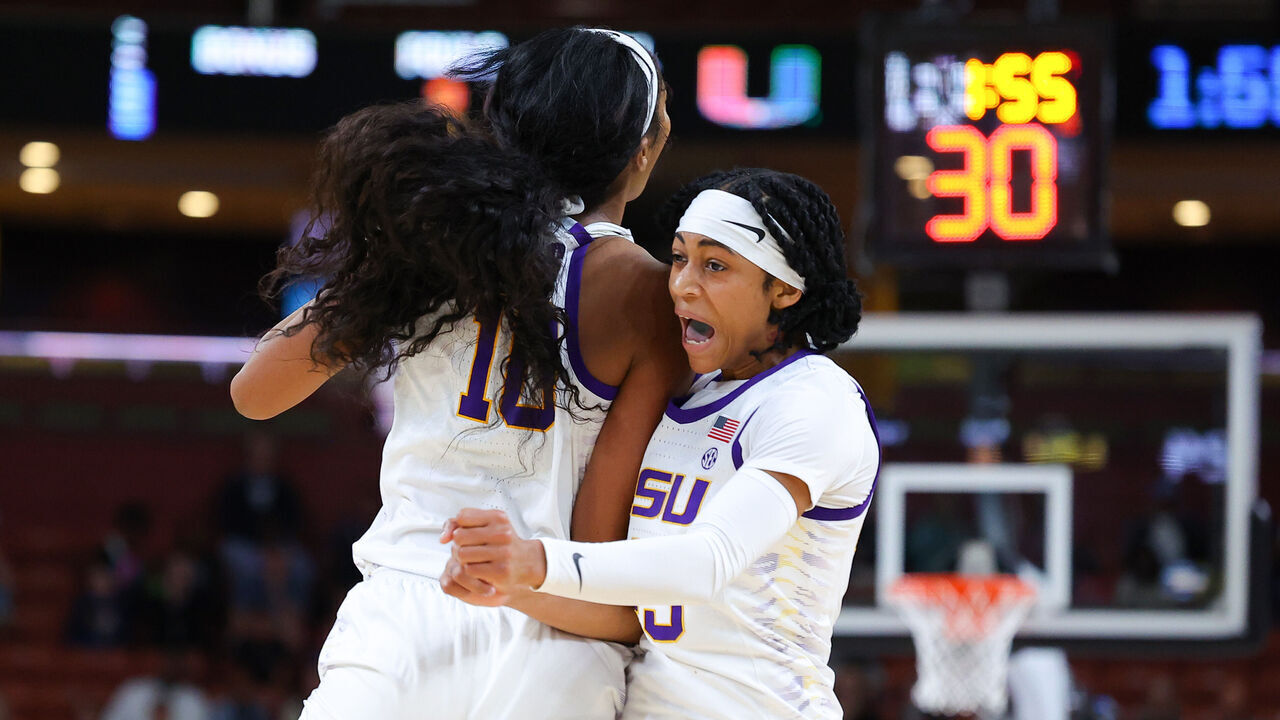 GREENVILLE, SOUTH CAROLINA - MARCH 26: Angel Reese #10 and Alexis Morris #45 of the LSU Lady Tigers celebrate during the second quarter of the game against the Miami Hurricanes in the Elite Eight round of the NCAA Women's Basketball Tournament at Bon Secours Wellness Arena on March 26, 2023 in Greenville, South Carolina.