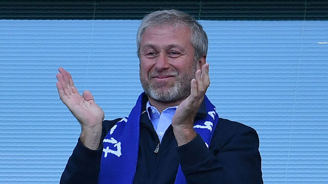 Chelsea's Russian owner Roman Abramovich applauds, as players celebrate their league title win at the end of the Premier League football match between Chelsea and Sunderland at Stamford Bridge in London on May 21, 2017. - Chelsea's extended victory parade reached a climax with the trophy presentation on May 21, 2017 after being crowned Premier League champions with two games to go. -