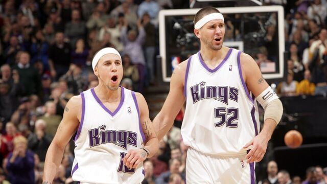 SACRAMENTO, CA - JANUARY 19: Mike Bibby #10 and Brad Miller #52 of the Sacramento Kings celebrate in overtime against the Los Angeles Lakers on January 19, 2006 at the ARCO Arena in Sacramento, California. The Kings defeated the Lakers 118-109 in overtime. NOTE TO USER: User expressly acknowledges and agrees that, by downloading and/or using this Photograph, user is consenting to the terms and conditions of the Getty Images License Agreement. Mandatory Copyright Notice: Copyright 2006 NBAE