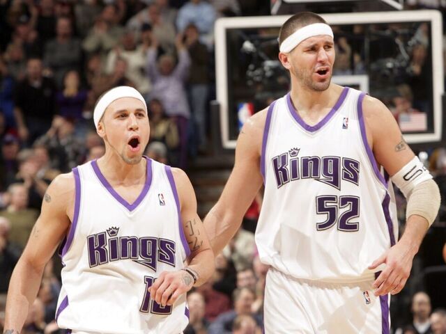 SACRAMENTO, CA - JANUARY 19: Mike Bibby #10 and Brad Miller #52 of the Sacramento Kings celebrate in overtime against the Los Angeles Lakers on January 19, 2006 at the ARCO Arena in Sacramento, California. The Kings defeated the Lakers 118-109 in overtime. NOTE TO USER: User expressly acknowledges and agrees that, by downloading and/or using this Photograph, user is consenting to the terms and conditions of the Getty Images License Agreement. Mandatory Copyright Notice: Copyright 2006 NBAE