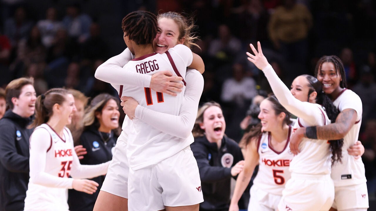 SEATTLE, WASHINGTON - MARCH 27: Elizabeth Kitley #33 and D'asia Gregg #11 of the Virginia Tech Hokies celebrate after defeating the Ohio State Buckeyes 84-74 in the Elite Eight round of the NCAA Women's Basketball Tournament at Climate Pledge Arena on March 27, 2023 in Seattle, Washington.