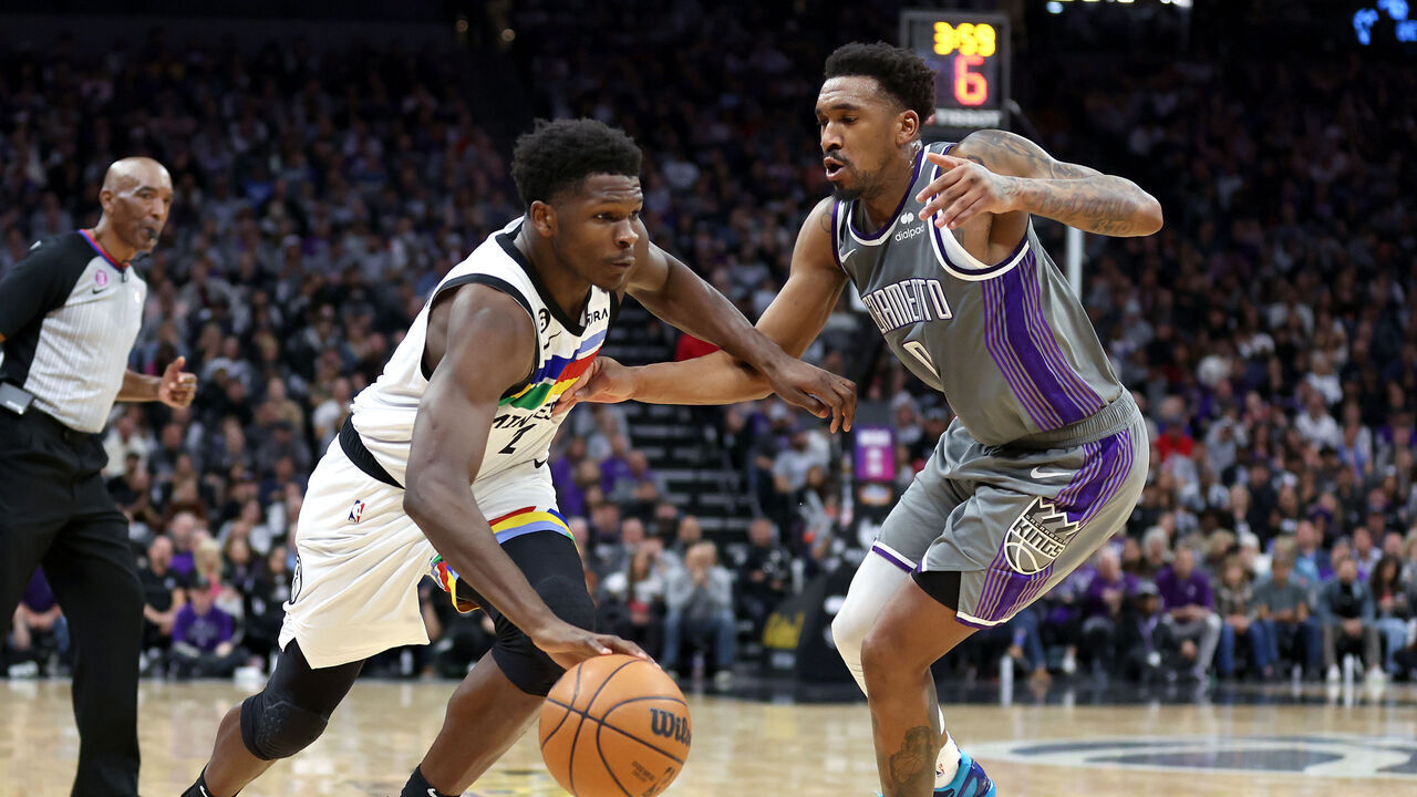 SACRAMENTO, CALIFORNIA - MARCH 27: Anthony Edwards #1 of the Minnesota Timberwolves is guarded by Malik Monk #0 of the Sacramento Kings in the second half at Golden 1 Center on March 27, 2023 in Sacramento, California.