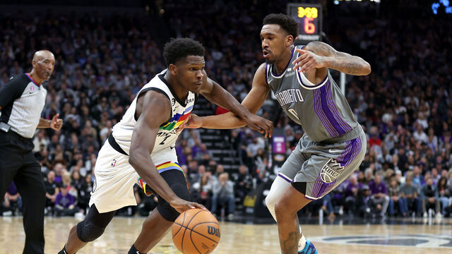 SACRAMENTO, CALIFORNIA - MARCH 27: Anthony Edwards #1 of the Minnesota Timberwolves is guarded by Malik Monk #0 of the Sacramento Kings in the second half at Golden 1 Center on March 27, 2023 in Sacramento, California.