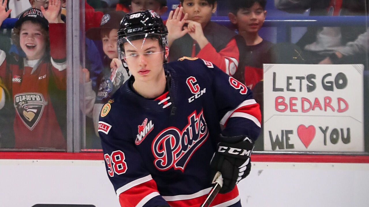 LANGLEY, BRITISH COLUMBIA - JANUARY 25: Fans cheer on Vancouver native forward Connor Bedard #98 of the Regina Pats skating for Team Red during the 2023 Kubota CHL Top Prospects Game at the Langley Events Centre on January 25, 2023 in Langley, British Columbia.