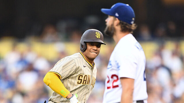 LOS ANGELES, CA - OCTOBER 12: San Diego Padres right fielder Juan Soto (22) looks at Los Angeles Dodgers pitcher Clayton Kershaw (22) after flying out to the wall during the NLDS Game 2 between the San Diego Padres and the Los Angeles Dodgers on October 12, 2022 at Dodger Stadium in Los Angeles, CA.
