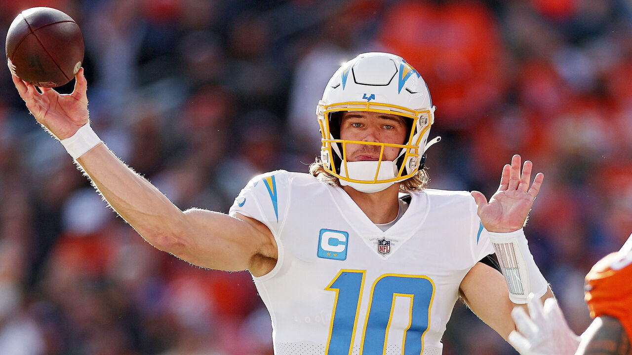 DENVER, COLORADO - JANUARY 08: Justin Herbert #10 of the Los Angeles Chargers warms up prior to a game against the Denver Broncos at Empower Field At Mile High on January 08, 2023 in Denver, Colorado.