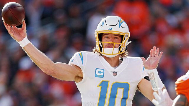 DENVER, COLORADO - JANUARY 08: Justin Herbert #10 of the Los Angeles Chargers warms up prior to a game against the Denver Broncos at Empower Field At Mile High on January 08, 2023 in Denver, Colorado.