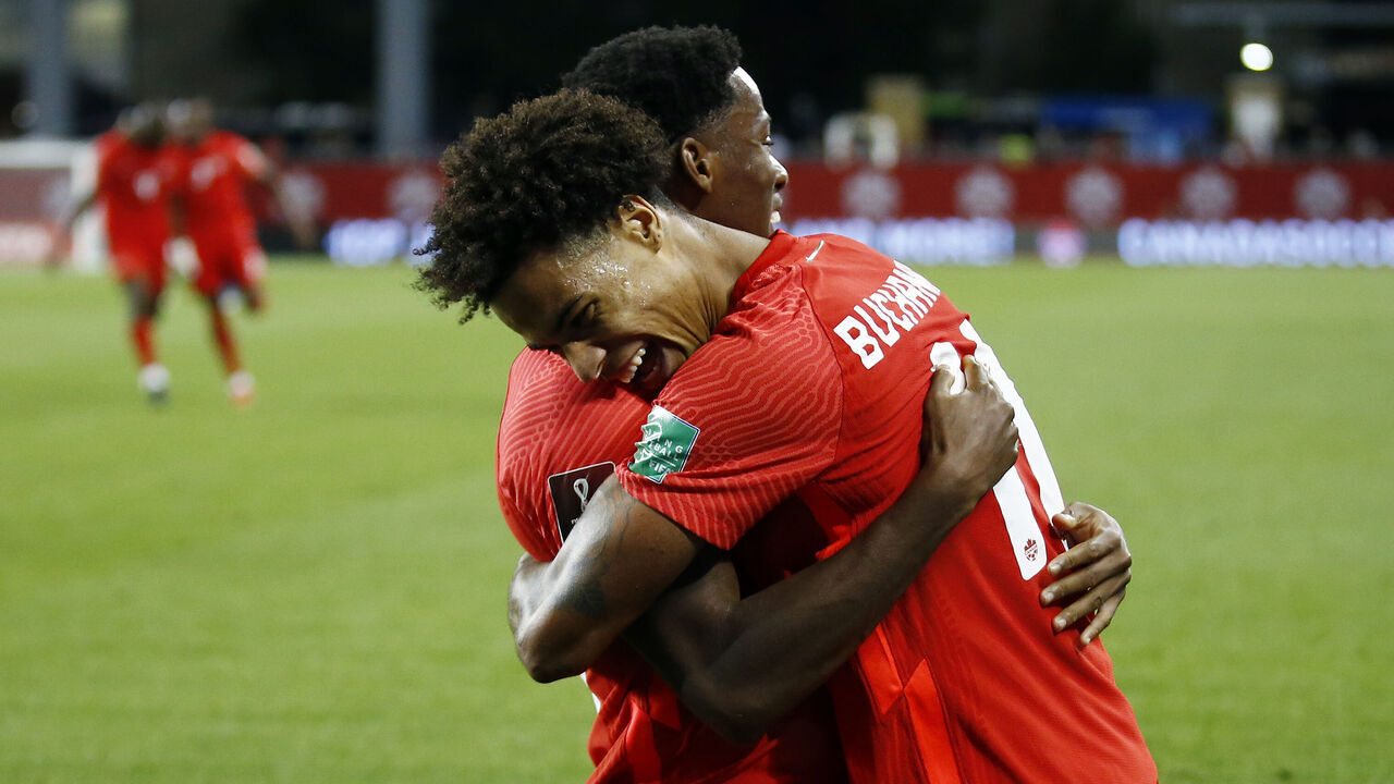 TORONTO, ON - SEPTEMBER 08: Tajon Buchanan #11 of Canada celebrates with Jonathan David #20 after scoring a goal during a 2022 World Cup Qualifying match against El Salvador at BMO Field on September 8, 2021 in Toronto, Ontario, Canada.