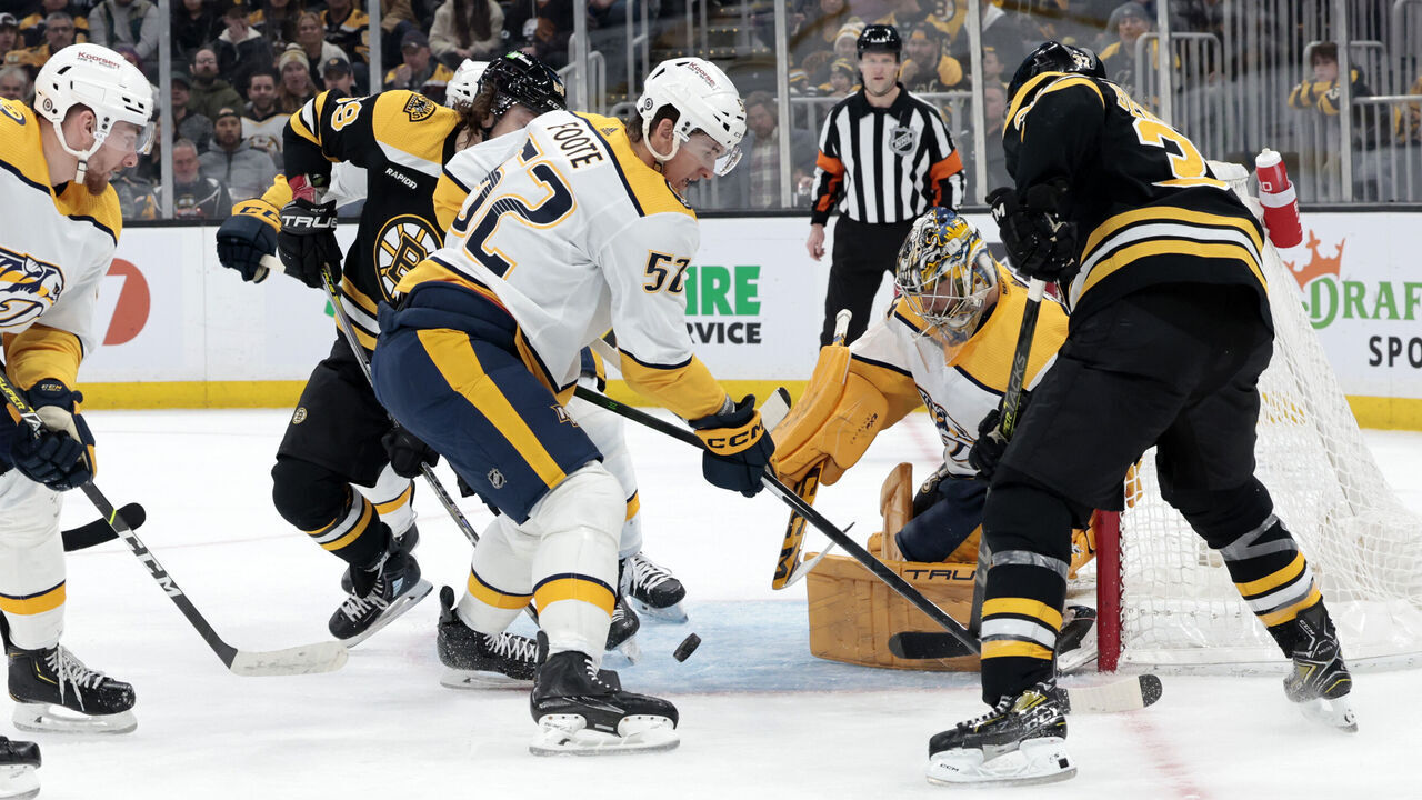 BOSTON, MA - MARCH 28: Nashville Predators goalie Juuse Saros (74) looks for the loose puck during a game between the Boston Bruins and the Nashville Predators on March 28, 2023, at TD Garden in Boston, Massachusetts.