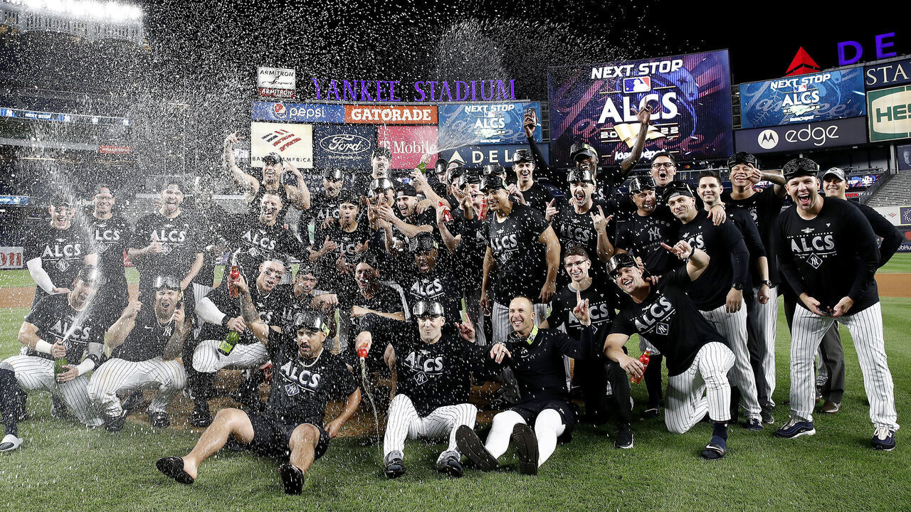 NEW YORK, NEW YORK - OCTOBER 18: The New York Yankees celebrate on the field after defeating the Cleveland Guardians in game five of the American League Division Series at Yankee Stadium on October 18, 2022 in New York, New York.