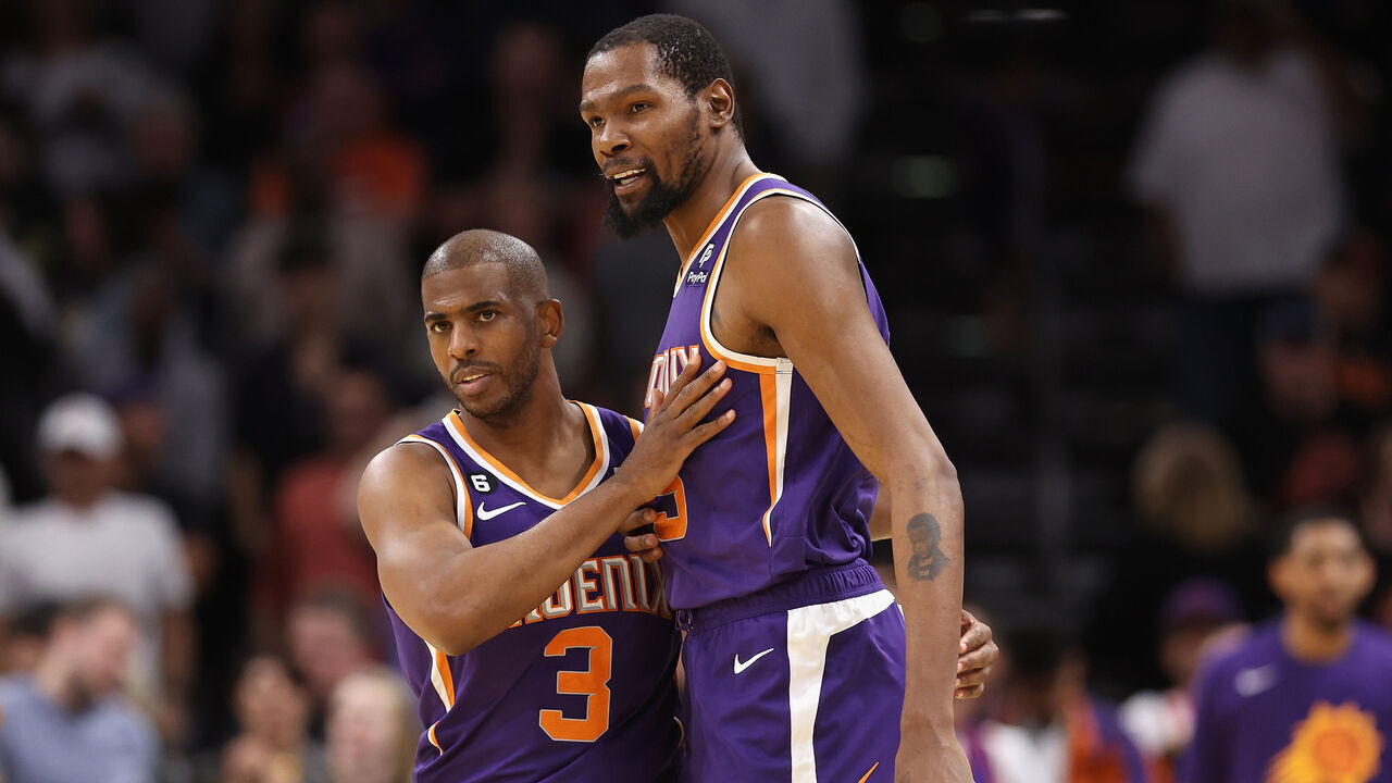 PHOENIX, ARIZONA - MARCH 29: Chris Paul #3 and Kevin Durant #35 of the Phoenix Suns celebrate after defeating the Minnesota Timberwolves in NBA game at Footprint Center on March 29, 2023 in Phoenix, Arizona. The Suns defeated the Timberwolves 107-100.
