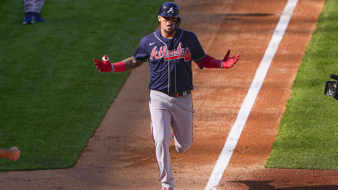 PHILADELPHIA, PA - OCTOBER 15: Atlanta Braves Second Baseman Orlando Arcia (11) reacts to hitting a home run as he rounds the bases during the third inning of Game 4 of the NLDS between the Atlanta Braves and the Philadelphia Phillies on October 15, 2022, at Citizens Bank Park in Philadelphia, PA.