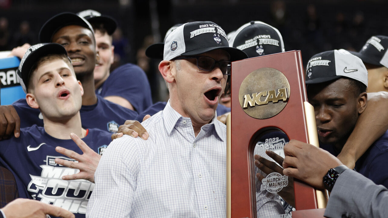 LAS VEGAS, NEVADA - MARCH 25: Head coach Dan Hurley of the Connecticut Huskies celebrates with players after defeating the Gonzaga Bulldogs 82-54 in the Elite Eight round of the NCAA Men's Basketball Tournament at T-Mobile Arena on March 25, 2023 in Las Vegas, Nevada.