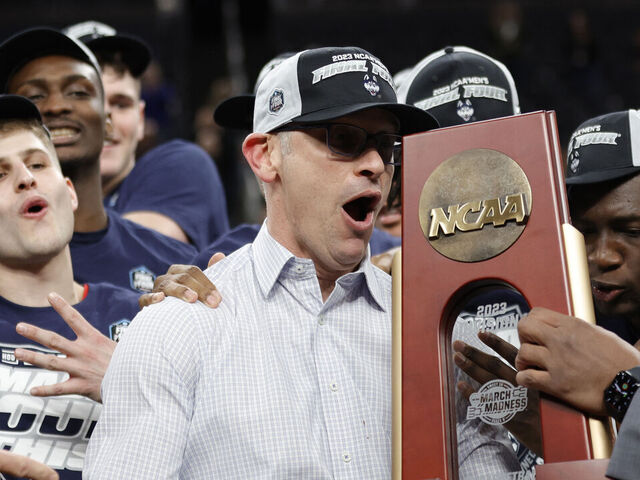 LAS VEGAS, NEVADA - MARCH 25: Head coach Dan Hurley of the Connecticut Huskies celebrates with players after defeating the Gonzaga Bulldogs 82-54 in the Elite Eight round of the NCAA Men's Basketball Tournament at T-Mobile Arena on March 25, 2023 in Las Vegas, Nevada.