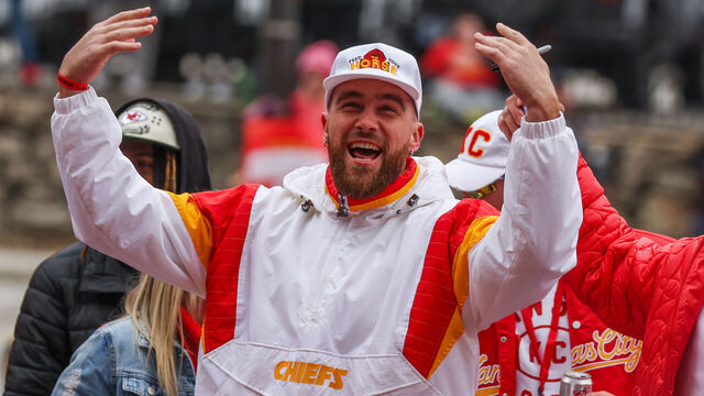 KANSAS CITY, MO - FEBRUARY 15: Kansas City Chiefs tight end Travis Kelce (87) raises his hands to fire up the crowd during the Chiefs Super Bowl LVII Victory Parade on February 15, 2023 in Kansas City, MO.