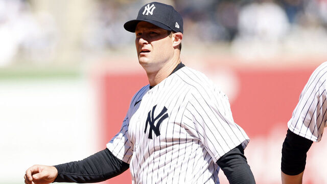 BRONX, NEW YORK - MARCH 30: Gerrit Cole #45 reacts with DJ LeMahieu #26 of the New York Yankees after making an out at first during the fifth inning against the San Francisco Giants on Opening Day at Yankee Stadium on March 30, 2023 in the Bronx borough of New York City.