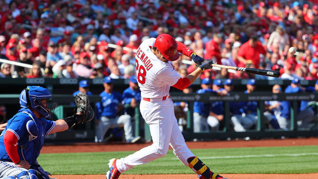 ST. LOUIS, MO - MARCH 30: Nolan Arenado #28 of the St. Louis Cardinals singles on a line drive during the game between the Toronto Blue Jays and the St. Louis Cardinals at Busch Stadium on Thursday, March 30, 2023 in St. Louis, Missouri.