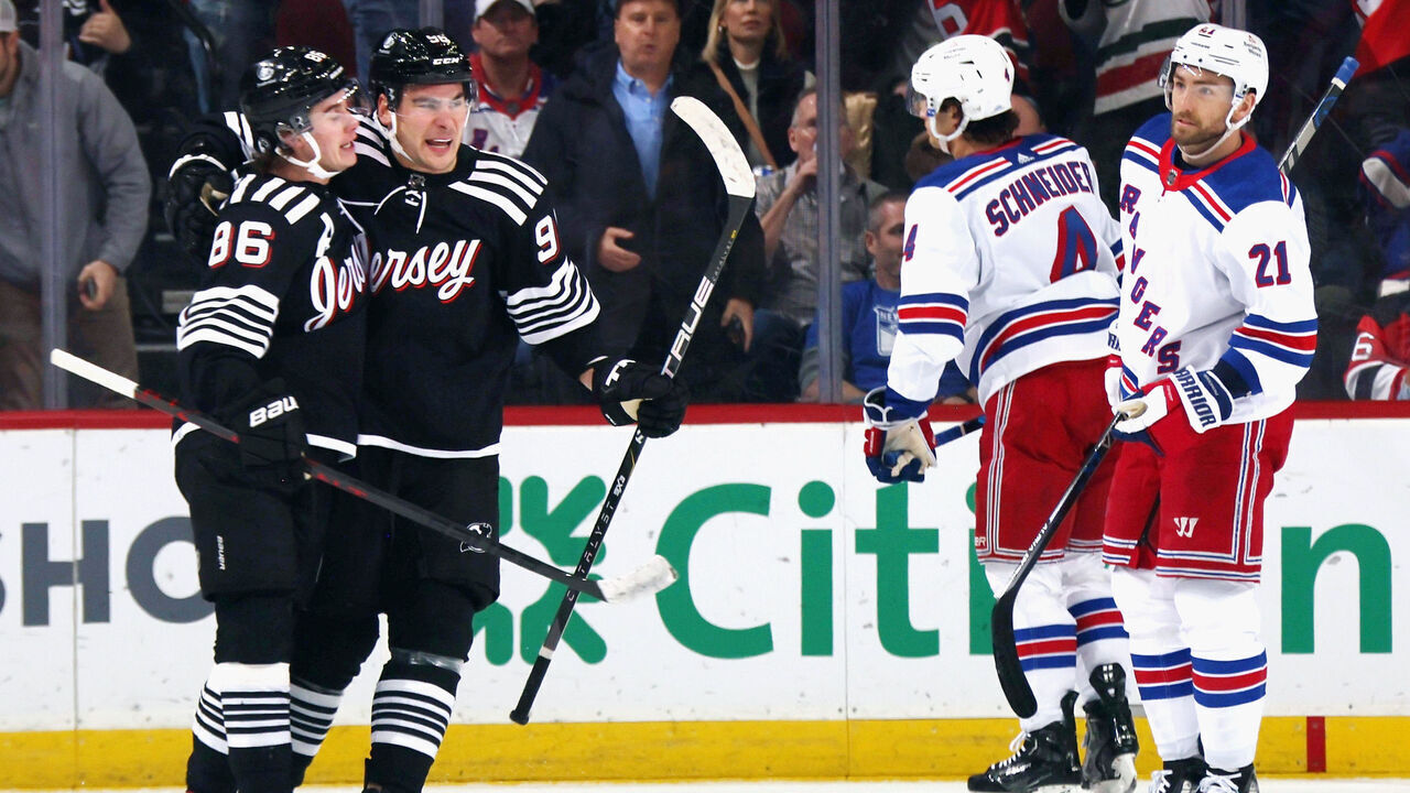 NEWARK, NEW JERSEY - MARCH 30: Timo Meier #96 of the New Jersey Devils (R) celebrates his first period powerplay goal against the New York Rangers and is joined by Jack Hughes #86 (L) at the Prudential Center on March 30, 2023 in Newark, New Jersey.