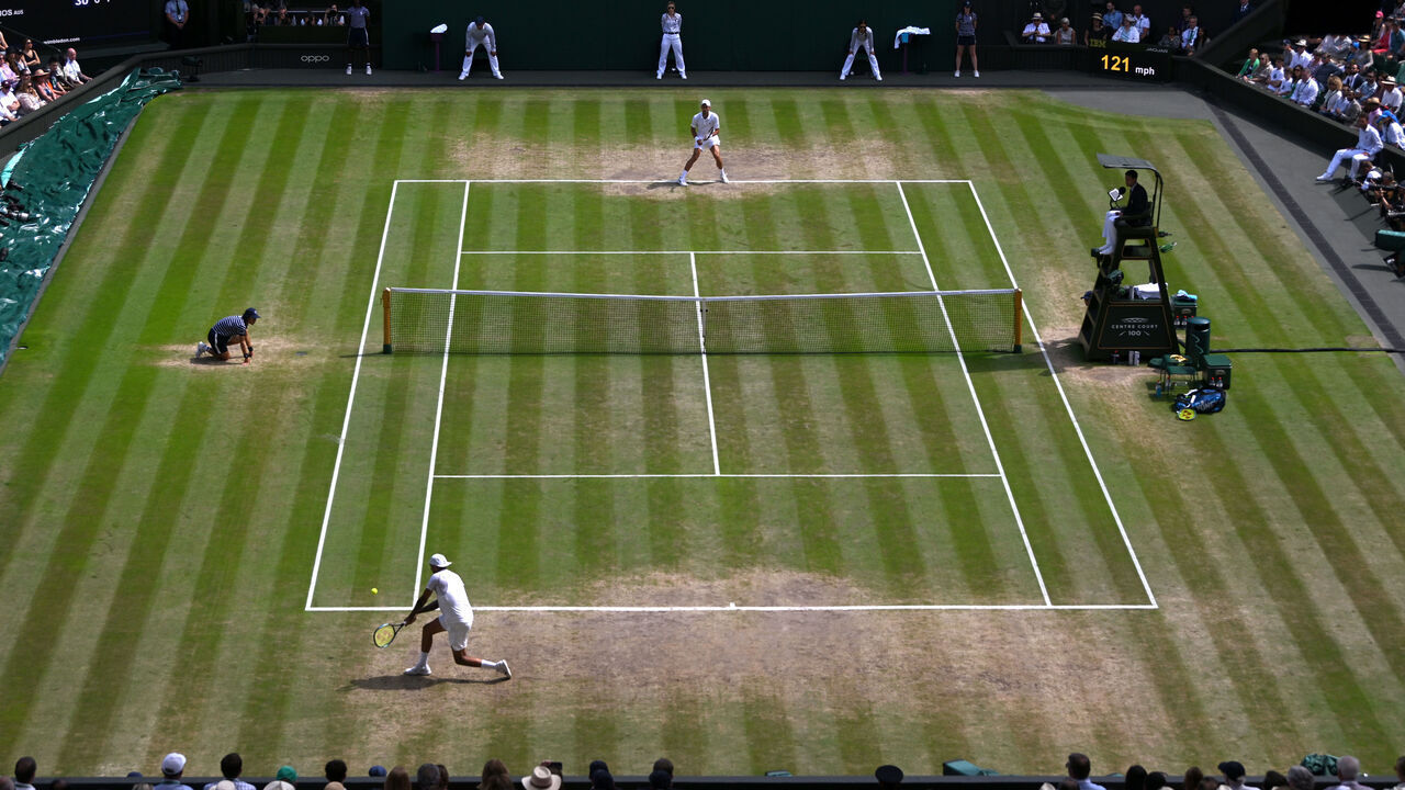 LONDON, ENGLAND - JULY 10: A general view as Nick Kyrgios of Australia plays a backhand against Novak Djokovic of Serbia during their Men's Singles Final match on day fourteen of The Championships Wimbledon 2022 at All England Lawn Tennis and Croquet Club on July 10, 2022 in London, England.