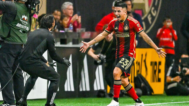 ATLANTA, GA MARCH 18: Atlanta midfielder Thiago Almada (23) reacts with trainer Mario Cruz after scoring a goal during the MLS match between the Portland Timbers and Atlanta United FC on March 18th, 2023 at Mercedes-Benz Stadium in Atlanta, GA.