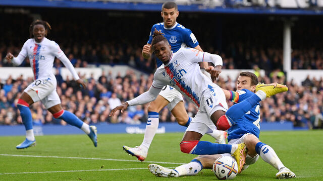 LIVERPOOL, ENGLAND - OCTOBER 22: Wilfried Zaha of Crystal Palace is challenged by Seamus Coleman of Everton during the Premier League match between Everton FC and Crystal Palace at Goodison Park on October 22, 2022 in Liverpool, England.