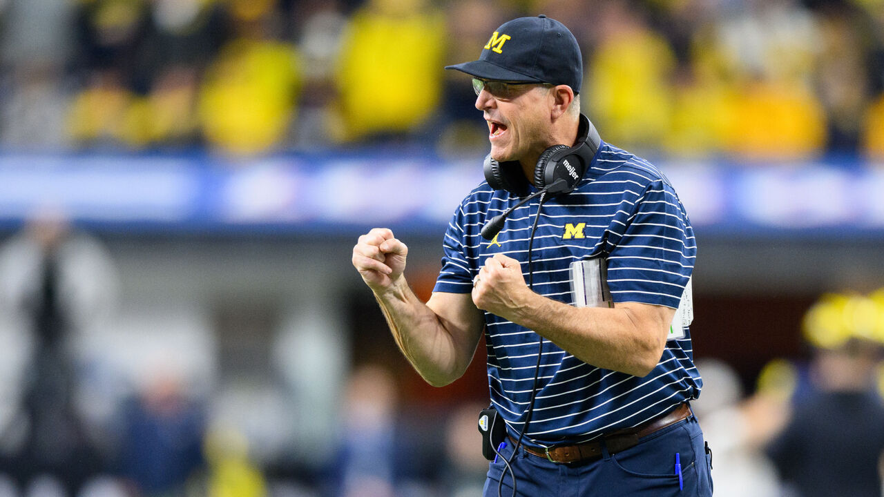 INDIANAPOLIS, IN - DECEMBER 03: Michigan Wolverines head coach Jim Harbaugh celebrates on the field during the Big 10 Championship game between the Michigan Wolverines and Purdue Boilermakers on December 3, 2022, at Lucas Oil Stadium in Indianapolis, IN.