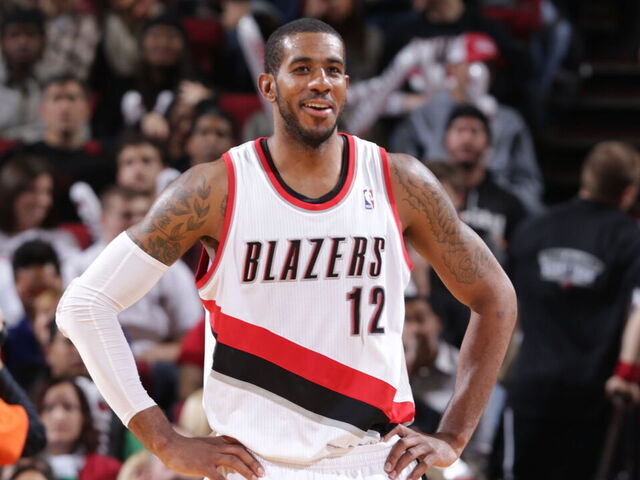 PORTLAND, OR - NOVEMBER 25: LaMarcus Aldridge #12 of the Portland Trail Blazers smiles during the game against the New York Knicks on November 25, 2013 at the Moda Center Arena in Portland, Oregon. Mandatory Copyright Notice: Copyright 2013 NBAE
