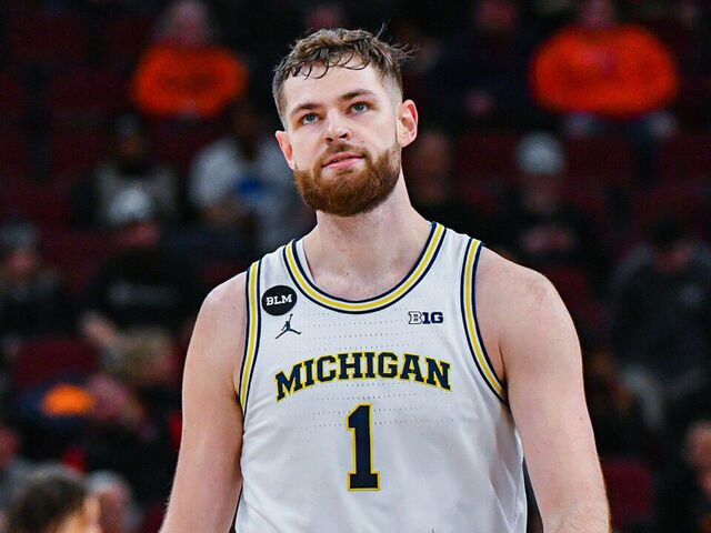 CHICAGO, ILLINOIS - MARCH 09: Hunter Dickinson #1 of the Michigan Wolverines reacts after a turnover during the second half of a Big Ten Men's Basketball Tournament Second Round game against the Rutgers Scarlet Knights at United Center on March 09, 2023 in Chicago, Illinois. The Rutgers Scarlet Knights won the game 62-50 over the Michigan Wolverines.