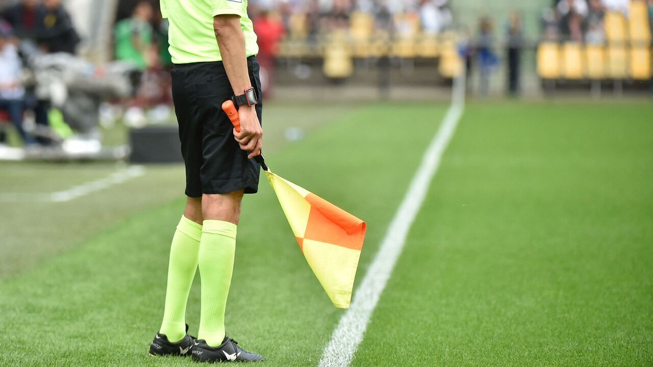 Assistant referee Djemel Zitouni stands during the French L1 football match between FC Metz and Olympique Lyonnais (Lyon) at Stade Saint-Symphorien in Longeville-les Metz, eastern France on May 8, 2022.