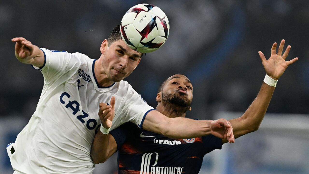 Marseille's Ukrainian midfielder Ruslan Malinovskyi (L) fights for the ball with Montpellier's French midfielder Arnaud Nordin during the French L1 football match between Marseille (OM) and Montpellier at the Velodrome stadium in Marseille, on March 31, 2023.