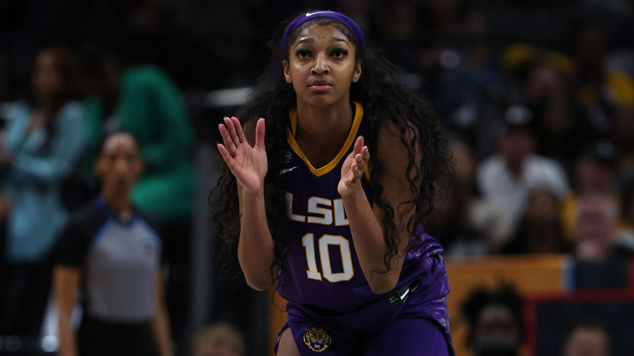 DALLAS, TEXAS - MARCH 31: Angel Reese #10 of the LSU Lady Tigers reacts during the third quarter against the Virginia Tech Hokies during the 2023 NCAA Women's Basketball Tournament Final Four semifinal game at American Airlines Center on March 31, 2023 in Dallas, Texas.