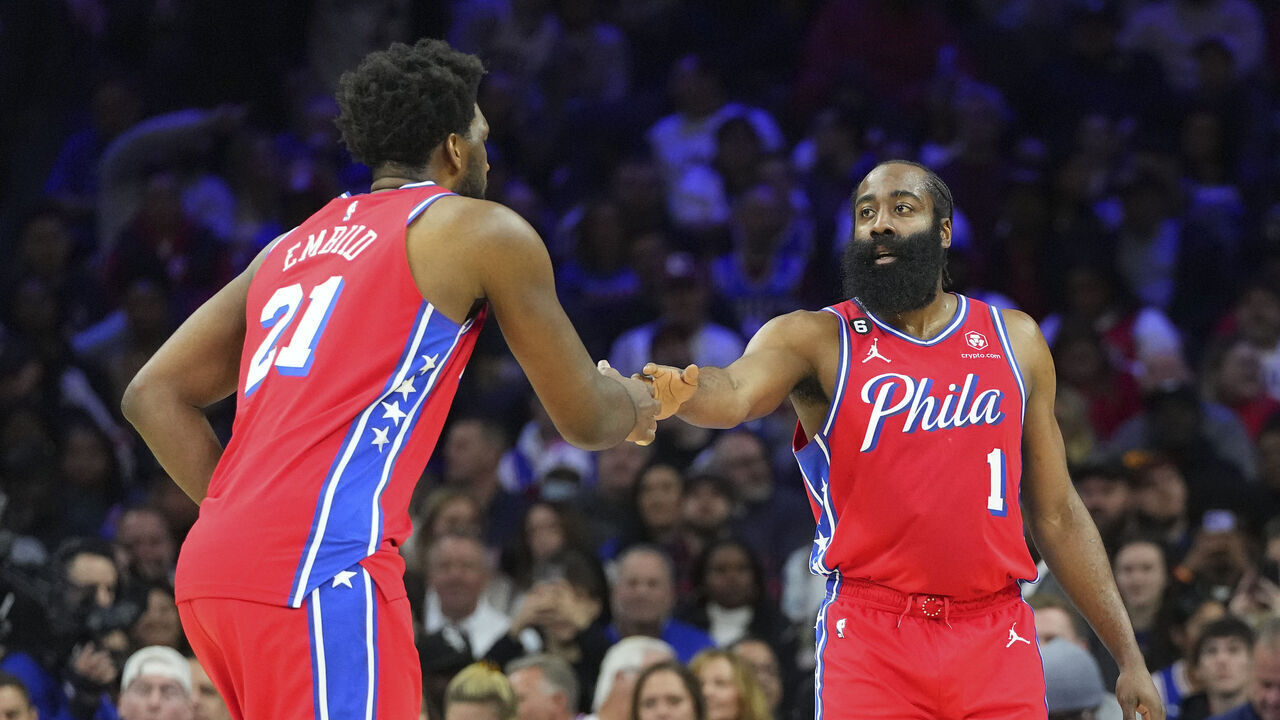 PHILADELPHIA, PA - MARCH 31: Joel Embiid #21 of the Philadelphia 76ers celebrates with teammate James Harden #1 against the Toronto Raptors in the second quarter at the Wells Fargo Center on March 31, 2023 in Philadelphia, Pennsylvania.