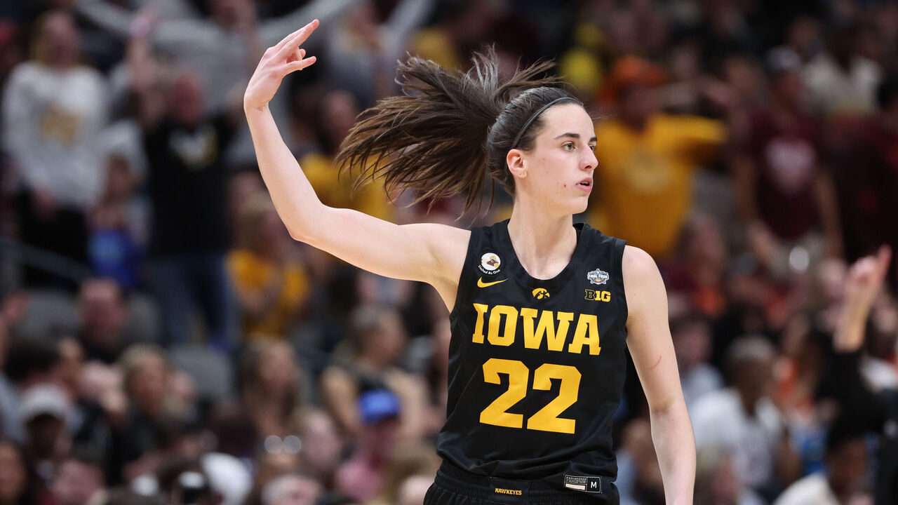 DALLAS, TX - MARCH 31: Caitlin Clark #22 of the Iowa Hawkeyes celebrates making a three-point shot against the South Carolina Gamecocks during the semifinals of the NCAA Women's Basketball Tournament Final Four at American Airlines Center on March 31, 2023 in Dallas, Texas.