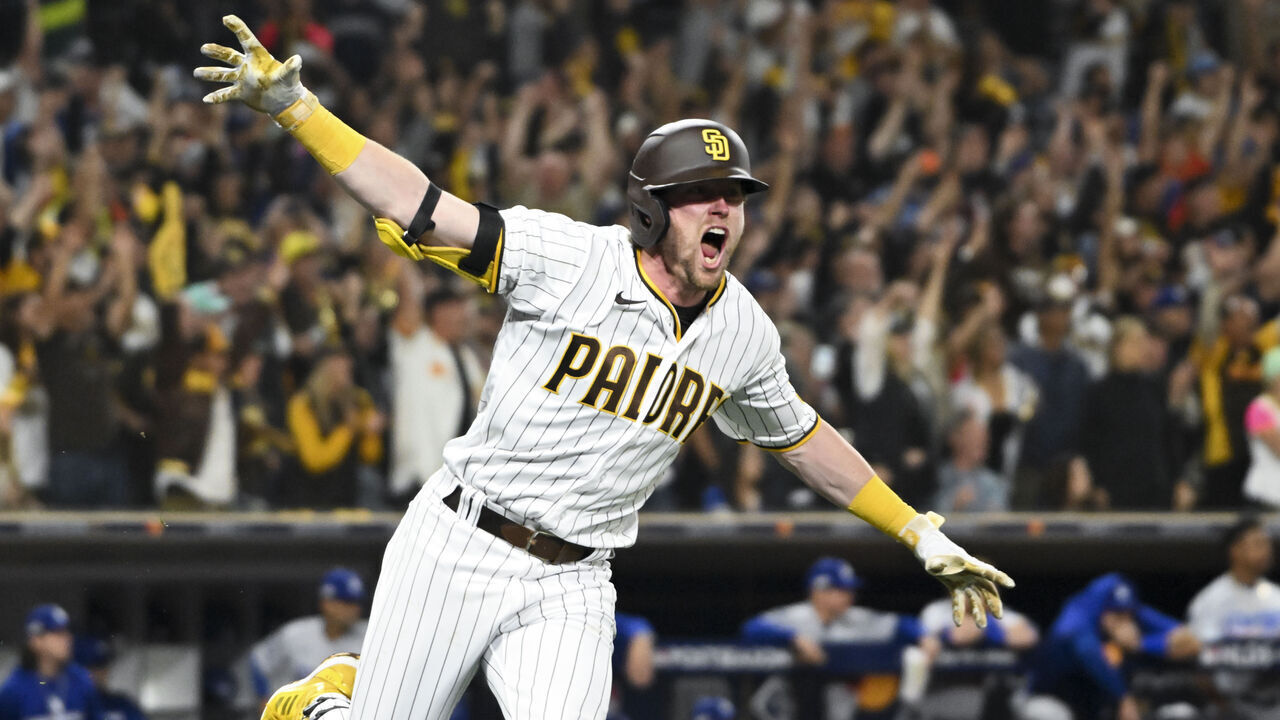 San Diego, CA - October 15: San Diego Padres second baseman Jake Cronenworth, left, celebrates after hitting the go-ahead two-run double during the seventh inning in game 4 of the NLDS against the Los Angeles Dodgers at Petco Park on Saturday, Oct. 15, 2022 in San Diego, CA. (Wally Skalij / Los Angeles Times via Getty Images)