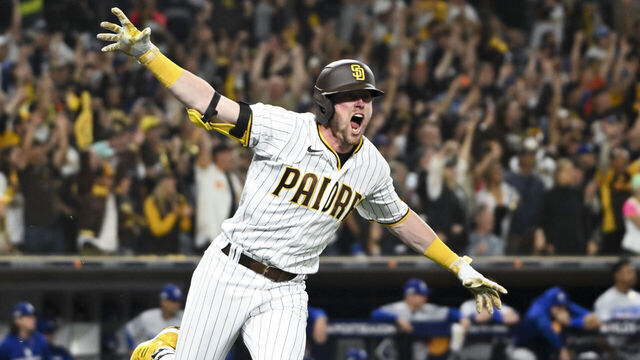 San Diego, CA - October 15: San Diego Padres second baseman Jake Cronenworth, left, celebrates after hitting the go-ahead two-run double during the seventh inning in game 4 of the NLDS against the Los Angeles Dodgers at Petco Park on Saturday, Oct. 15, 2022 in San Diego, CA. (Wally Skalij / Los Angeles Times via Getty Images)