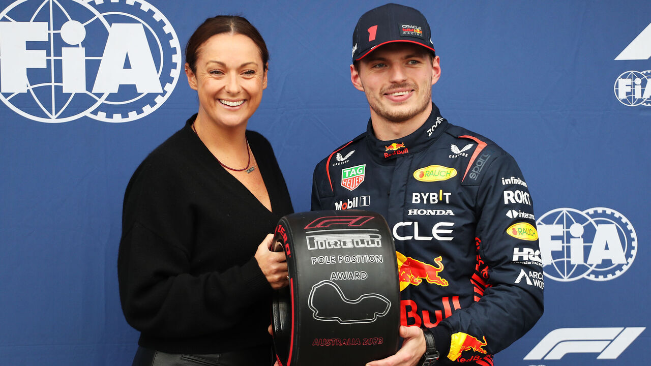 MELBOURNE, AUSTRALIA - APRIL 01: Pole position qualifier Max Verstappen of the Netherlands and Oracle Red Bull Racing is presented with the Pirelli Pole Position trophy by Celeste Barber in parc ferme during qualifying ahead of the F1 Grand Prix of Australia at Albert Park Grand Prix Circuit on April 01, 2023 in Melbourne, Australia.