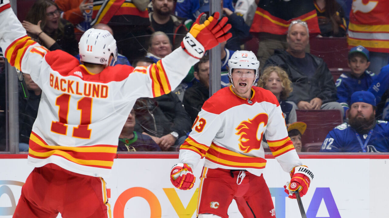 VANCOUVER, CANADA - MARCH 31: Tyler Toffoli #73 of the Calgary Flames celebrates after scoring the winning goal against the Vancouver Canucks in overtime during their NHL game at Rogers Arena on March 31, 2023 in Vancouver, British Columbia, Canada.