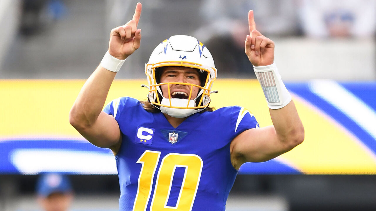 INGLEWOOD, CA - DECEMBER 18: Los Angeles Chargers quarterback Justin Herbert (10) celebrates during the NFL regular season game between the Tennessee Titans and the Los Angeles Chargers on December 18, 2022, at SoFi Stadium in Inglewood, CA.