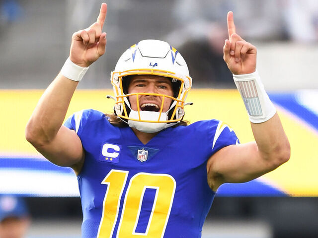 INGLEWOOD, CA - DECEMBER 18: Los Angeles Chargers quarterback Justin Herbert (10) celebrates during the NFL regular season game between the Tennessee Titans and the Los Angeles Chargers on December 18, 2022, at SoFi Stadium in Inglewood, CA.