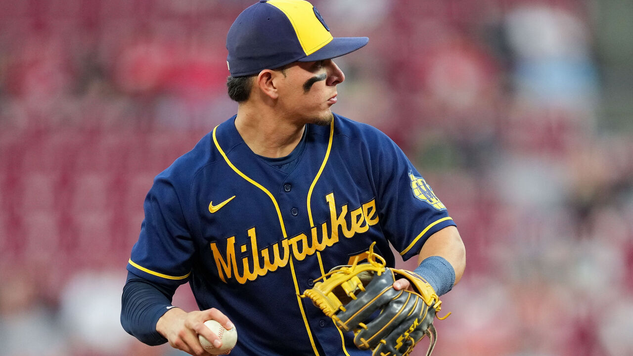 CINCINNATI, OHIO - SEPTEMBER 24: Luis Urias #2 of the Milwaukee Brewers throws to first base in the second inning against the Cincinnati Reds at Great American Ball Park on September 24, 2022 in Cincinnati, Ohio.