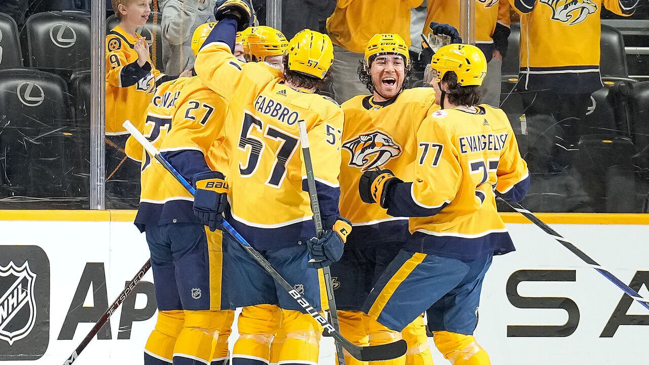 NASHVILLE, TENNESSEE - APRIL 1: Tommy Novak #82 celebrates his goal with Kiefer Sherwood #44, Luke Evangelista #77 and Dante Fabbro #57 of the Nashville Predators against the St. Louis Blues during an NHL game at Bridgestone Arena on April 1, 2023 in Nashville, Tennessee.