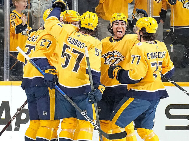 NASHVILLE, TENNESSEE - APRIL 1: Tommy Novak #82 celebrates his goal with Kiefer Sherwood #44, Luke Evangelista #77 and Dante Fabbro #57 of the Nashville Predators against the St. Louis Blues during an NHL game at Bridgestone Arena on April 1, 2023 in Nashville, Tennessee.