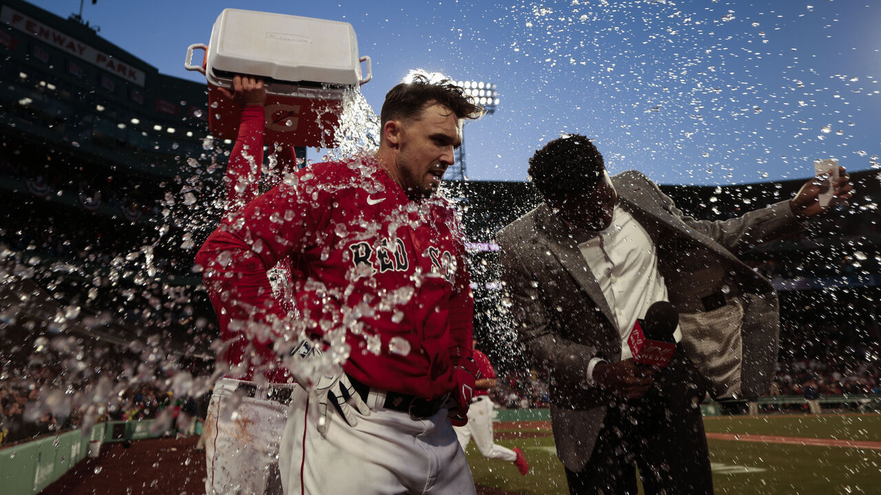 BOSTON, MASSACHUSETTS - APRIL 01: Adam Duvall #18 of the Boston Red Sox is showered in Gatorade after hitting a walk off home run against the Baltimore Orioles at Fenway Park on April 01, 2023 in Boston, Massachusetts.