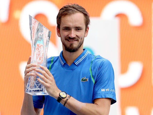 Daniil Medvedev of Russia, right, poses after winning the final