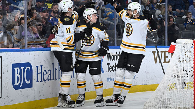 ST. LOUIS, MO - APRIL 2: Oskar Steen #62 of the Boston Bruins is congratulated after scoring a goal against the St. Louis Blues at the Enterprise Center on April 2, 2023 in St. Louis, Missouri.